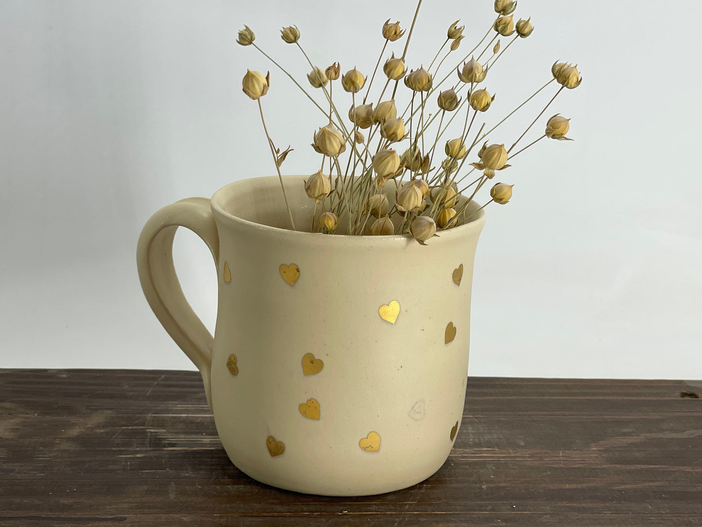 Zelta sirsniņu krūze