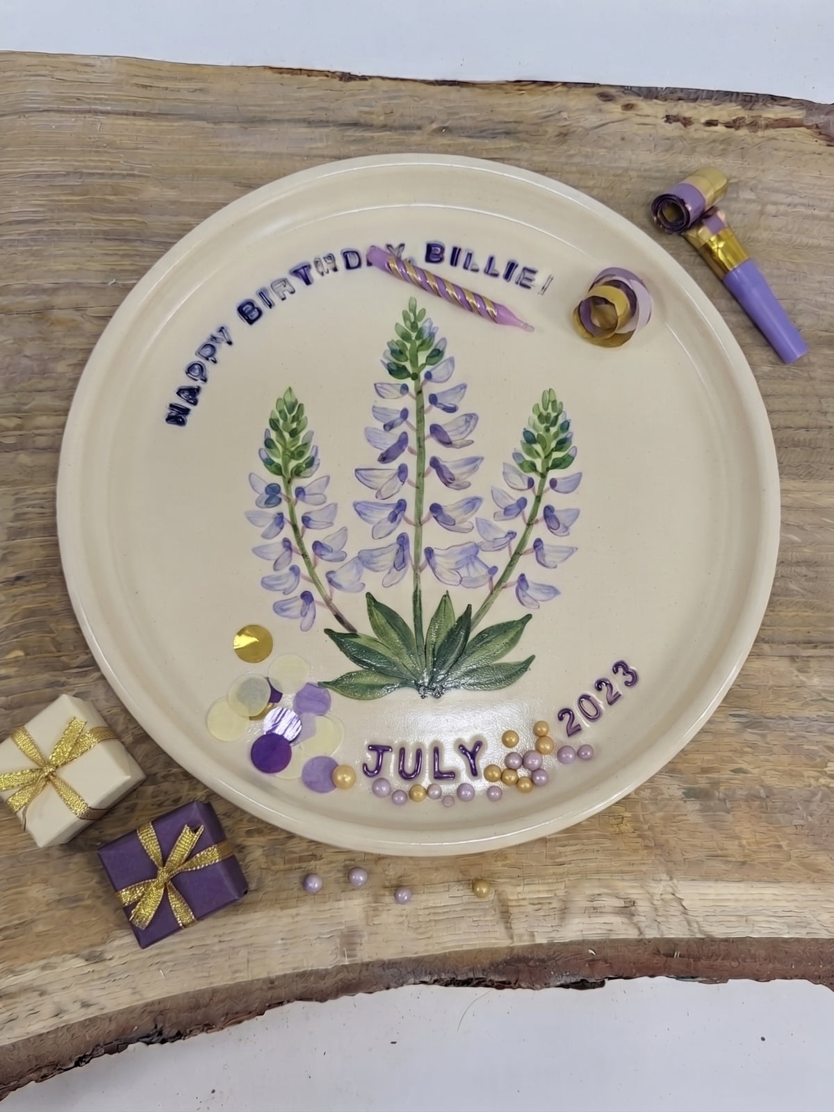 A hand-painted ceramic happy birthday plate