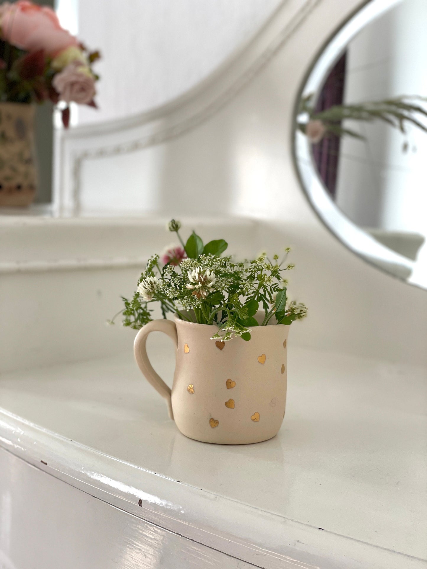 Zelta sirsniņu krūze