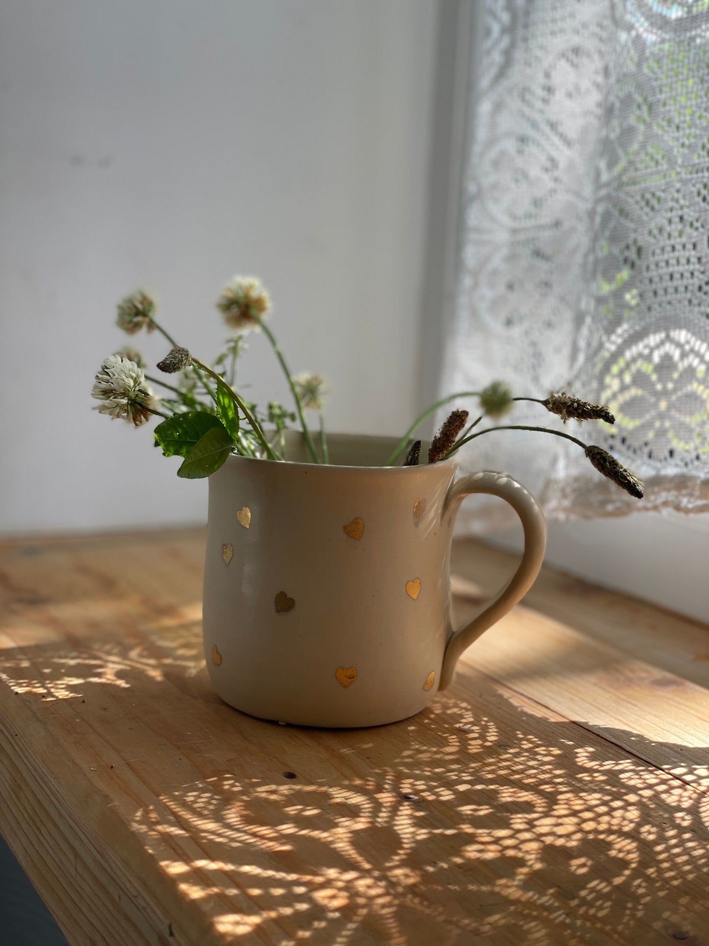 Zelta sirsniņu krūze